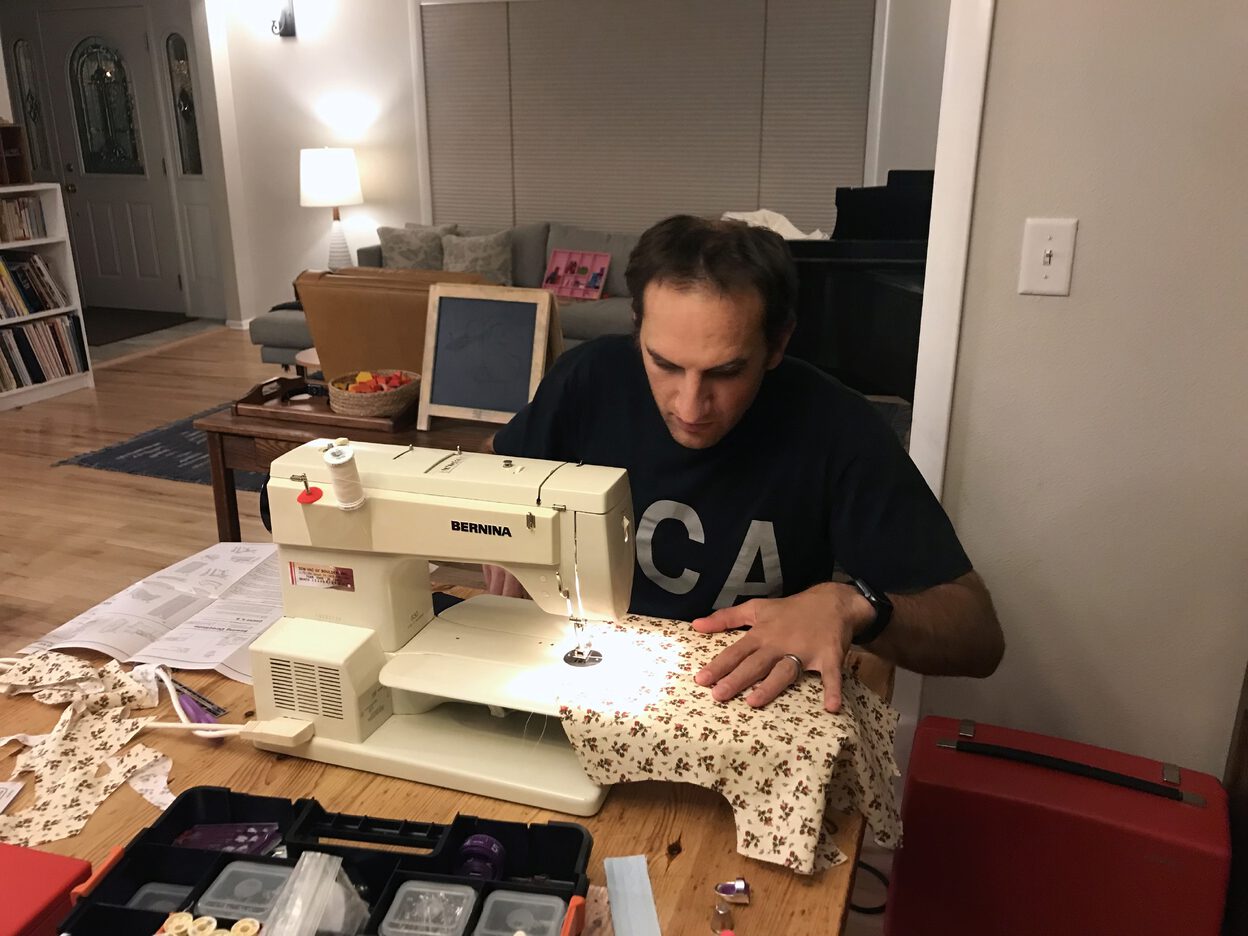 At the sewing machine